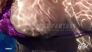 Busty Filipina wife shows off her big tits in the outdoor pool