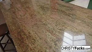 hot christy mack plays with her amazing tits and wet pussy on the kitchen counter