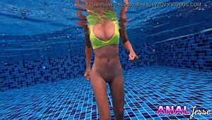 Asian girl boldly swims with big butt plug