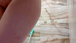 A stunning red-haired milf locked herself in the bathroom to masturbate and cum