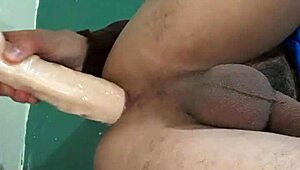 Look at him playing with that dildo! So hot!