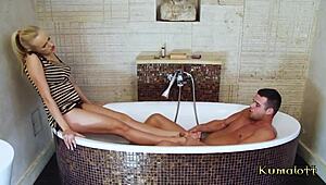 Hey, Check Out This Hot Babe Giving A Footjob In The Bath