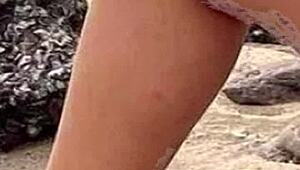 Drawing a hot african woman in bikini on the beach while masturbating