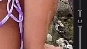 Drawing a hot african woman in bikini on the beach while masturbating