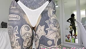 melody radford tries on pink micro bikini with chain. watch her sexy milf curves!