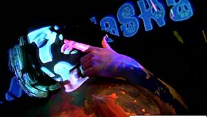 Busty Natasha Nice masturbates nude in sexy black light video.