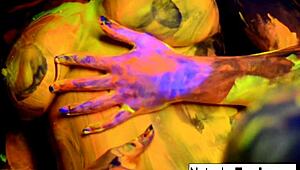 Busty Natasha Nice masturbates nude in sexy black light video.