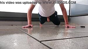 Masked babe jerks off wildly on wet balcony