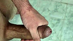 Young bisexual guy masturbates in the shower in this homemade video.