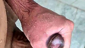 Young bisexual guy masturbates in the shower in this homemade video.