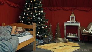 the blonde babe moans as her lesbian friend fucks her with a dildo on christmas