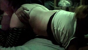 A couple enjoys a private moment in the dark.