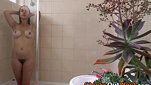 Showering Aussie teen flaunts huge natural tits solo