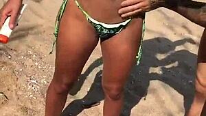 Beach Lesbians Apply Sunscreen in Tiny Bikinis