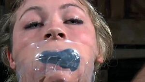 young bdsm babe gets restrained and choked by old maledom in bondage slave play.