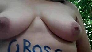 Female slave masturbates in outdoor forest bondage