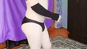 Sexy sissy crossdresser in pink pants and dress shows off big white ass.