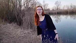 Redhaired teen undresses outdoors first time