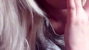 Blonde girl with big tits masturbates, moaning as she cums