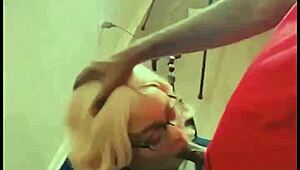 Blonde barbie takes monster black cock deep in her throat and swallows cumshot