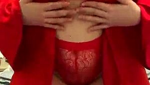 Brunette in red lingerie intensely masturbates her big tits and ass