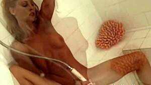 What's her name? This experienced redhead MILF masturbates with toys