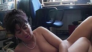 Mature brunette slut fucks at office