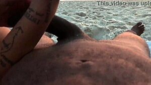 Casual couple plays risky exposure on public beach