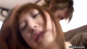 Cute Japanese teen slobbers and spits while working a hard cock in uncensored fun.