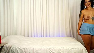 Big ass brunette masturbates on the bed, feeling every touch.