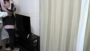 Young Couple Has Intimate Moments In Living Room Before School