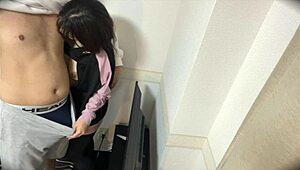 Young Couple Has Intimate Moments In Living Room Before School