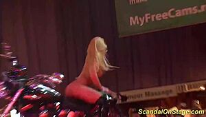 uhh, busty milf on stage strippin’ down, makin’ me crazy with them big ones, ya know?