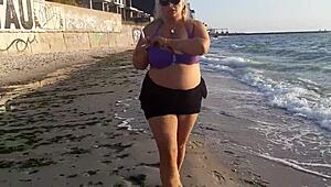 omg, im so horny watching this hot milf masturbate on the beach outside