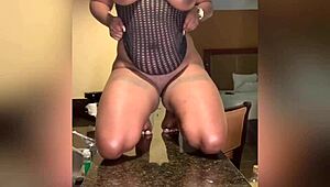 She was squirting all over the countertop in her kitchen, with her big tits bouncing