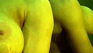 busty ginger flexes her big muscles in the mirror, looking strong