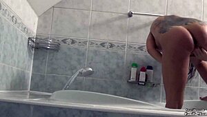 Sexy babe Camilla Moon caught masturbating her tight pussy in bathroom on cam