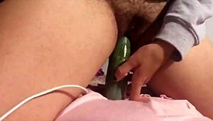 she inserts big cucumber into her cunt using toys
