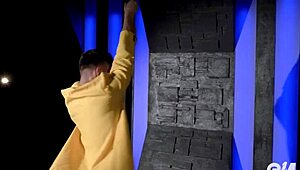 hot young gay guy performs acrobatic strip tease, ripping clothes while dancing on the pole