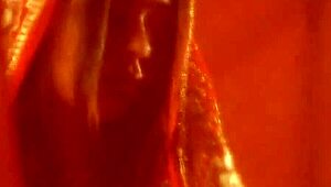 Brunette cougar dances erotically, teasing with striptease and undressing