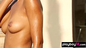 All natural ebony babe strips by the pool