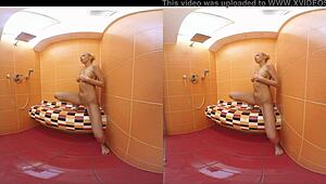 Blonde Karol Lilien masturbates bent over in shower