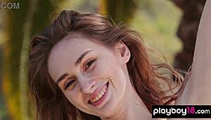 Big-boobed Ukrainian blondie Yana West strips and poses naked on the hillside.