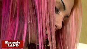 alternative shemale beauty wanks off solo in lingerie close-up.