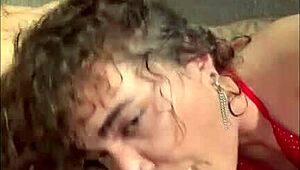 Curly haired nympho sucks hard in fishnet stockings