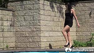 the brunette gets horny and fingers her shaved pussy outdoors. she plays with her small tits.