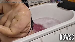 Pervert spies on BBW milf washing giant floppy tits in bath