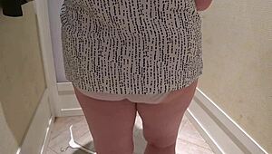 a hidden camera in the fitting room caught a mature chubby milf with a big booty trying on shorts.