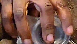 ebony self pleases her ass with toys