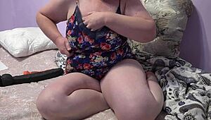 Chubby milf shakes big tits while fingering hairy pussy!